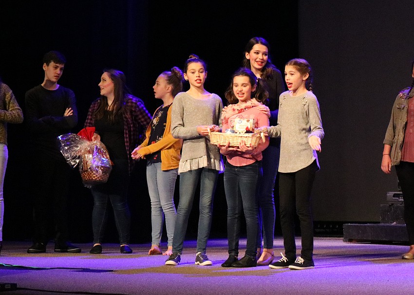 Kayleigh Lollar, Lexi Murnen, Anna Murnen and Kennedy Lollar, as church members, deliver baskets to the needy. Photo by Debby Hradek.