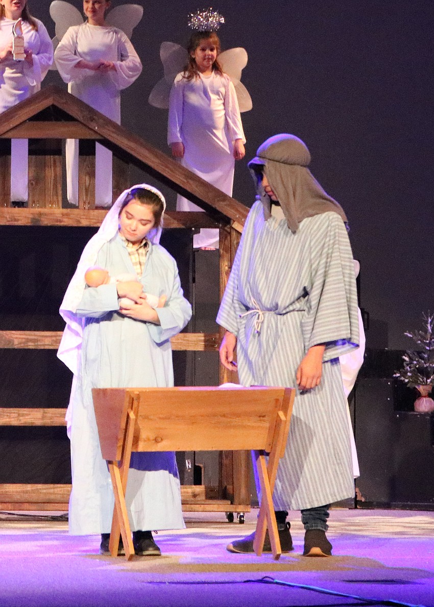 Ashley Murnen and Marc Dalmau portray Mary and Joseph during the play. Photo by Debby Hradek.