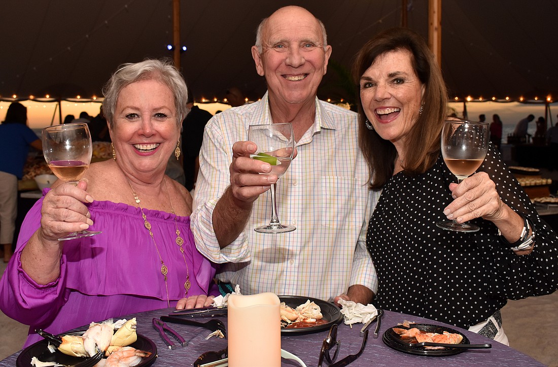 Ricki and Ralph Harvey and Beth Stewart at the 2018 Bacchus on the Beach.