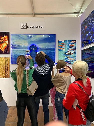 Guests enjoying AlexArt International artist Fabio Dal Boni&#39;s art at Spectrum Miami. Courtesy photo