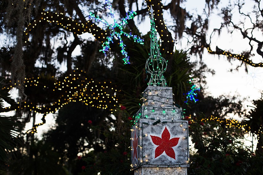 Lights welcome guests to the gardens.