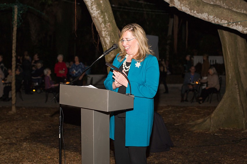Executive Director Jennifer Rominiecki tells guests facts about the light display.