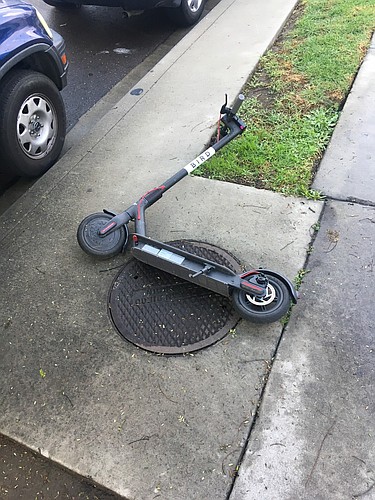 City Manager Tom Barwin said some feedback he&#39;s heard has raised concerns about storage. Residents in cities with e-scooters have said the devices, as seen on this San Diego sidewalk, clutter the public right of way.