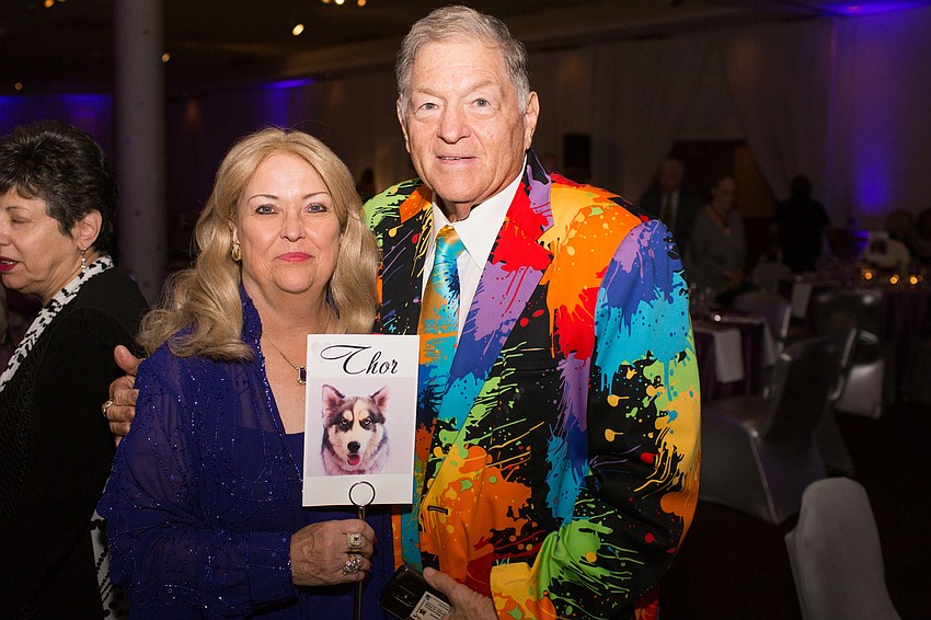 India and Bruce Lesser hold a photo of their husky, Thor, at the Animal Rescue Coalition’s Unconditional Love Gala on Feb. 24.