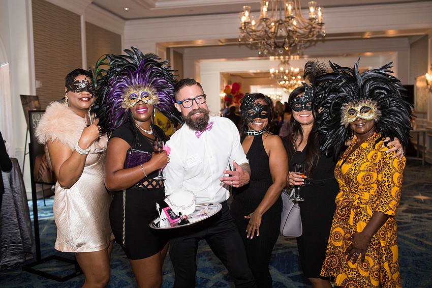 Danielle Calhoun, Tomeika Hunter Koski, Dan Starostecki, Theresa Covett, Jamie Irwin and Punchie Teal at Wine, Women and Shoes Nov. 9.