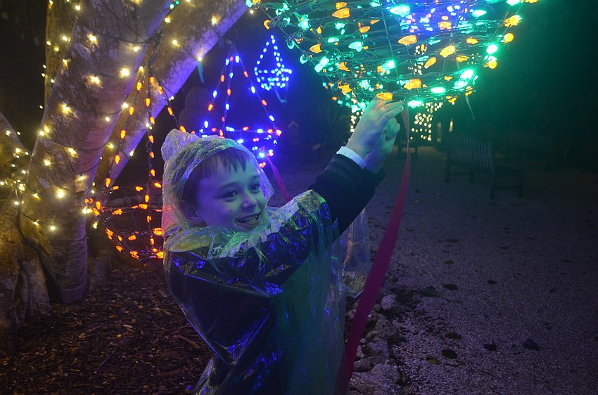 Eli Shepard ties a wish on the wishing tree in the gardens. His wish was for some pizza!