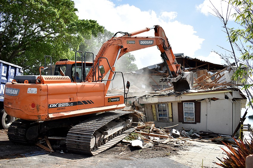 Heavy equipment moved in at the site of the former Pattigeorge’s restaurant to tear down the aging building and make way for Columbia Restaurant Group to develop The Buccaneer.