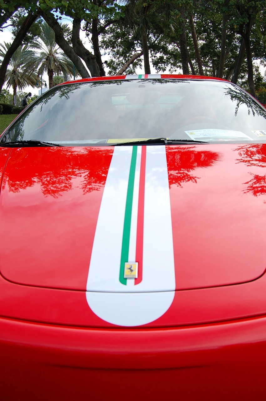 A car show with a distinctly Italian flair took to St. Armands Circle, much to the glee of car lovers and amateur photography buffs. Sponsored by a  Ferrari owners club, the car show raises money for Shriners' Children's Hospital.
