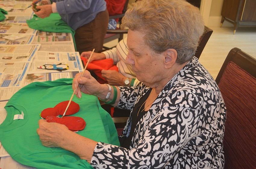 Mary Mercandetti also used ribbons and snowflakes on her sweater.