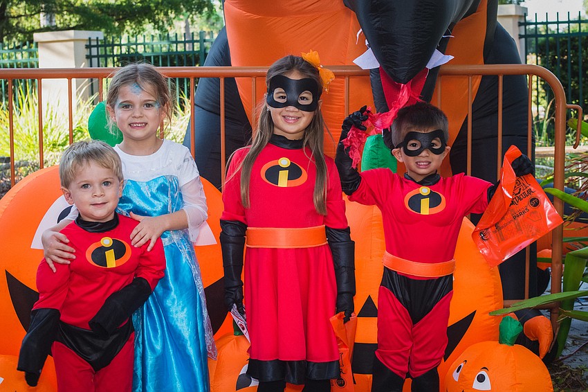 Superheroes, such as Lucas and Lilly Schaeffer with Skye and Paxton Schermerhorn, joined villains, witches, fairies and robots in taking  over Ed Smith Stadium for this year’s Howl-O-Ween Movie Night Spooktacular.