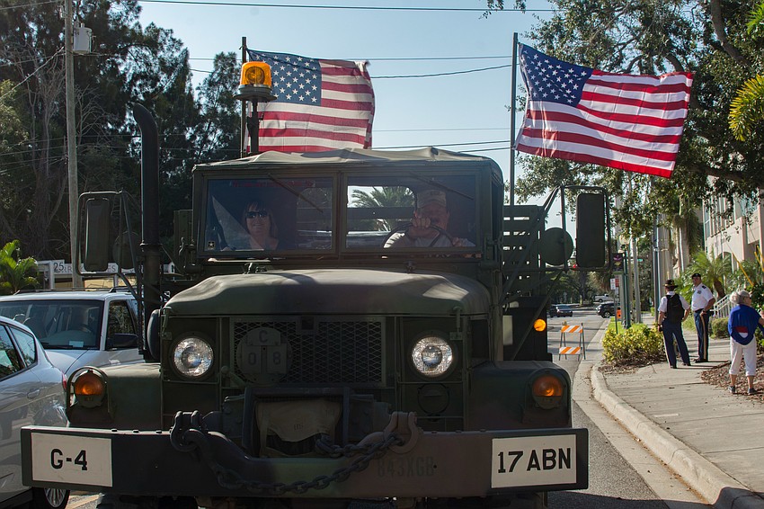 Patriotic people young and old crowded Main Street to pay tribute to those who served in uniform.
