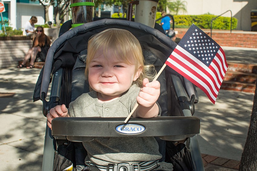 Patriotic people young and old crowded Main Street to pay tribute to those who served in uniform.