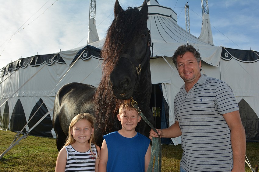 Ella Mowrey and Clayton Mowrey Jr.  pose with Olissio Zoppe before the show, along with the star, Veleno.