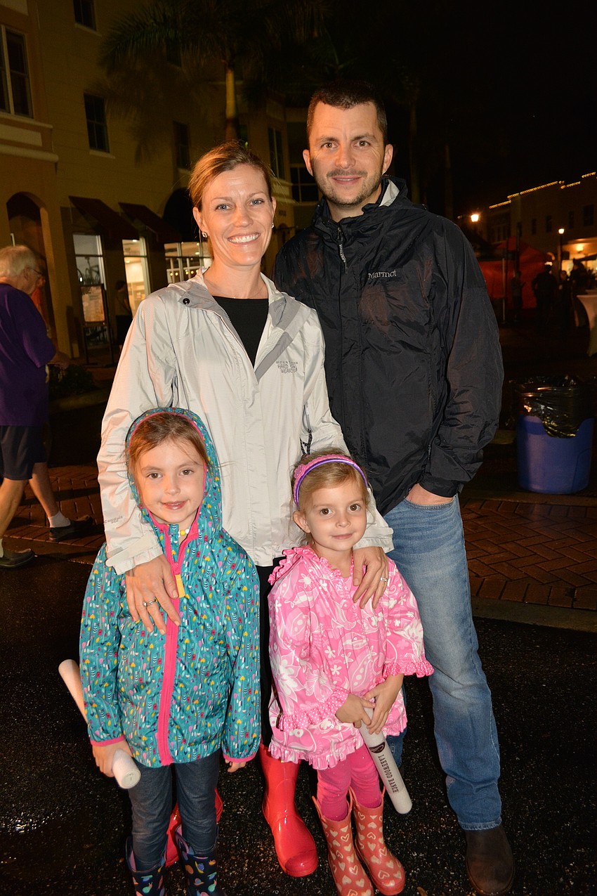 Ashley and Ryan McIntyre enjoy the night with their daughters, 6-year-old Katelyn (left) and 4-year-old Reagan (right).