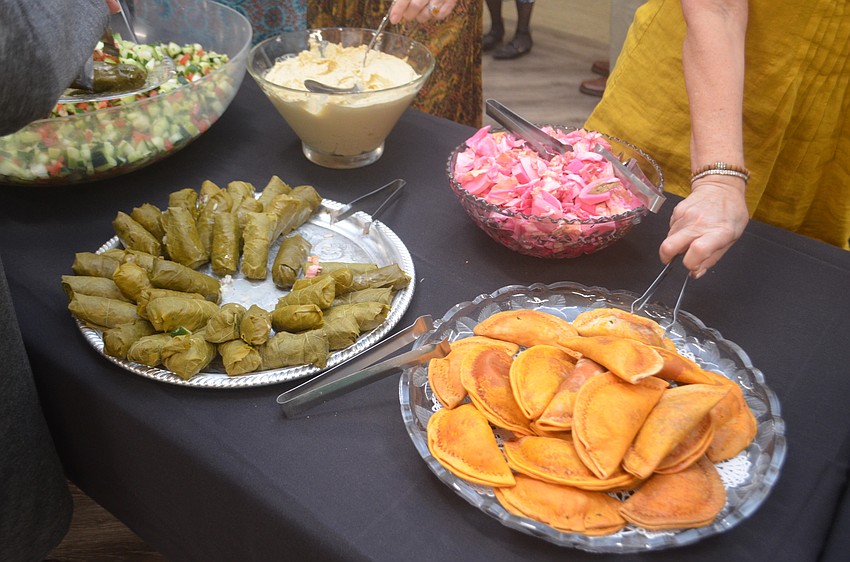 Traditional Israeli food is offered at the dinner, including grape leaves and pickled cabbage.