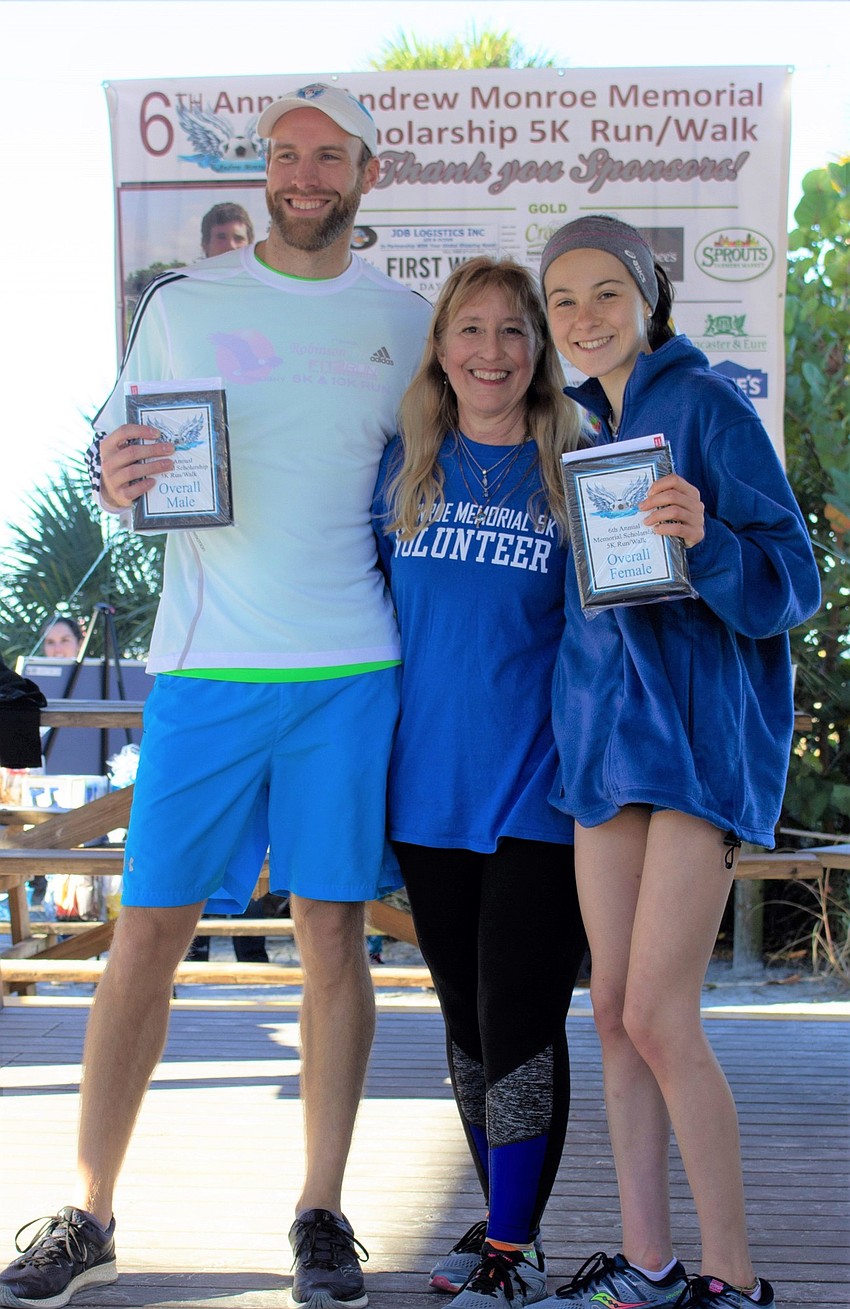 Overall male winner Corey Peyerk, Stacey Monroe and overall female winner Emma Paliotta pose after the race with their awards. Courtesy photo.