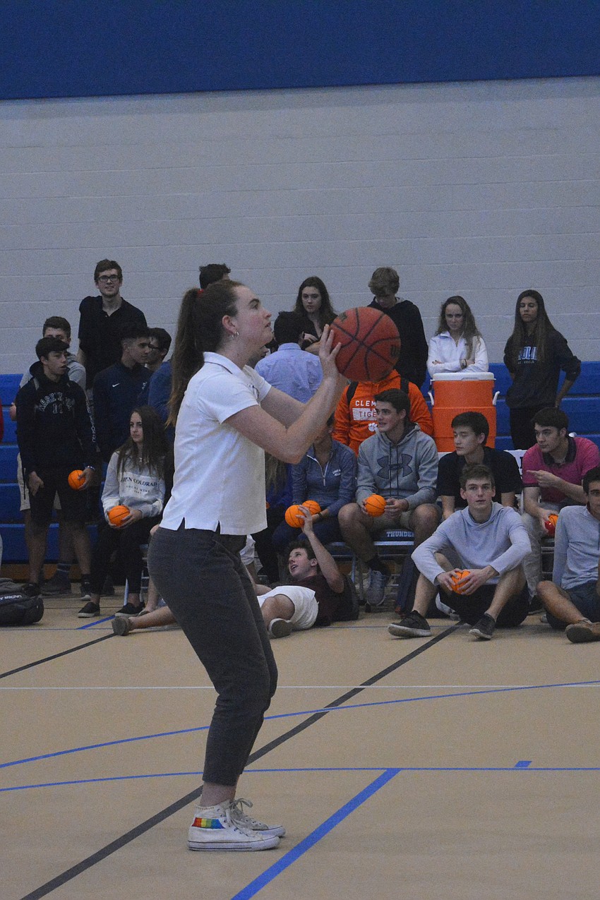 Adelaide Mahler takes a shot during the girls vs. boys free throw competition at Fox Field House.