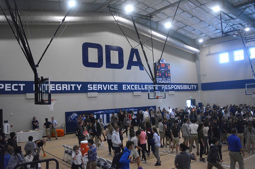 Students rush Fox Field House for the first time.
