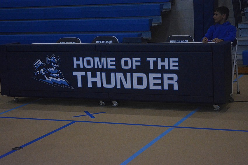 The scorer's table at Fox Field House makes sure opponents know where they are.