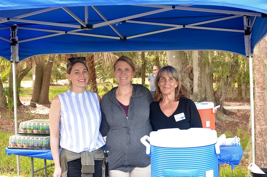 Jessica Tenbush, Megan Eidel and Peggy Thistle served food and handed out programs.