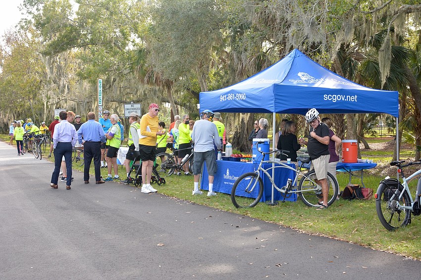 Trail-goers, bicyclists and members of Friends of the Legacy Trail congregated for the ribbon cutting ceremony.