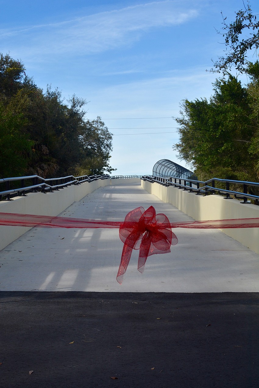 A red ribbon was cut by officials to celebrate the opening of the overpass.