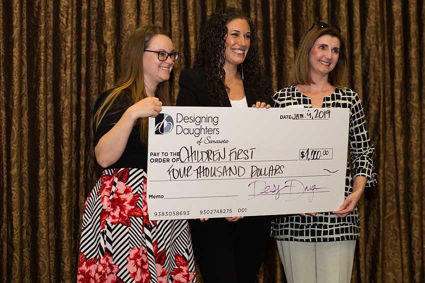 Children First representatives Megan Wenger and Jessica Rogers smile for a photo.