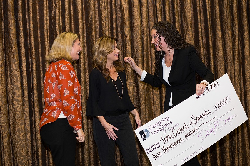 Elli Baldwin congratulates the representatives for Teen Court.