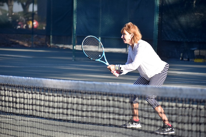 Kate Rhodes competes during a mixed doubles exhibition match.
