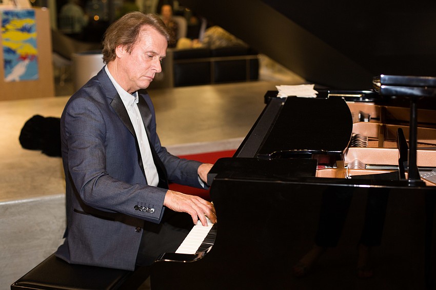 A pianist played music on the first floor.