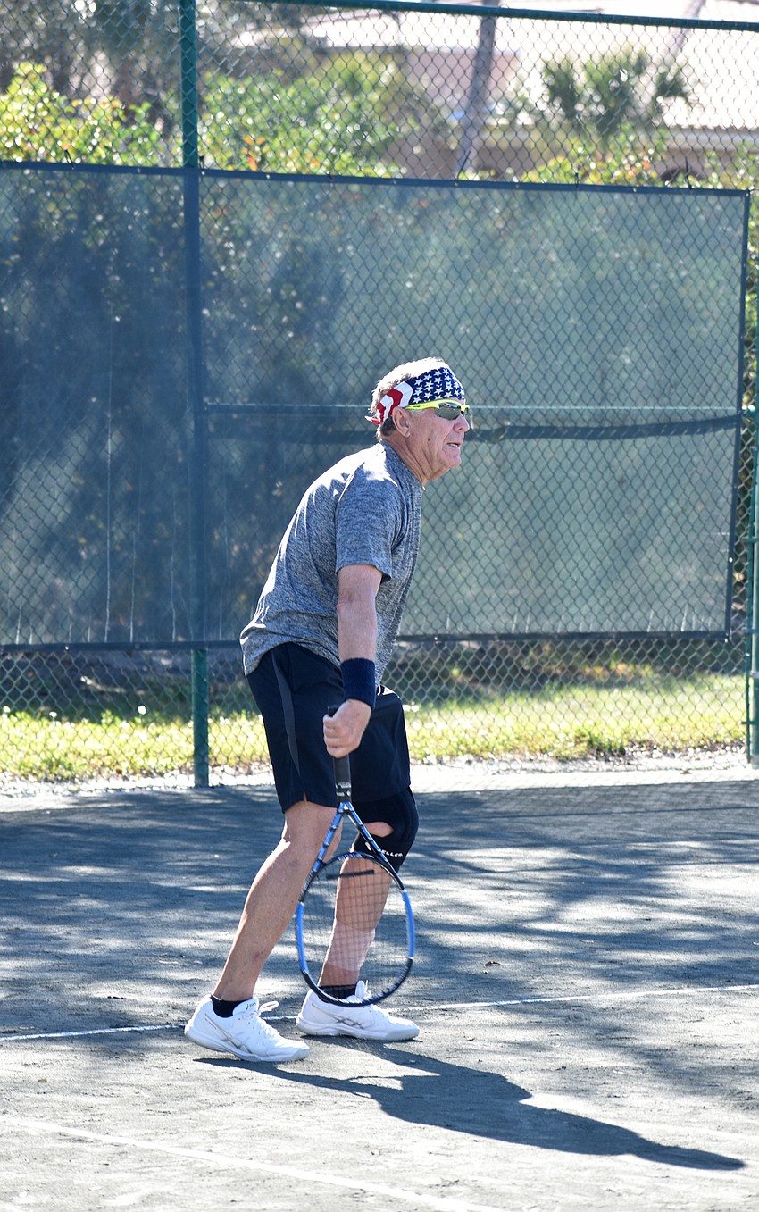 John Beeman competes in a mixed doubles match on Friday, Jan. 11.