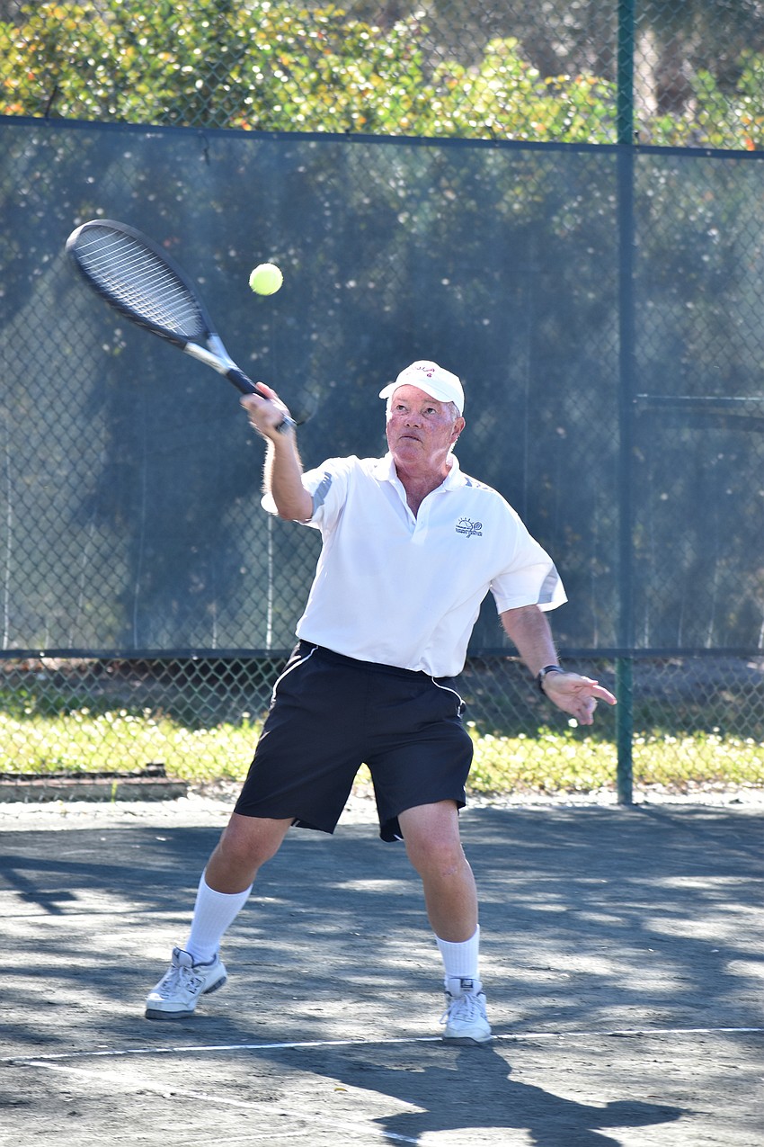 Tom Kane competes in a mixed doubles match.