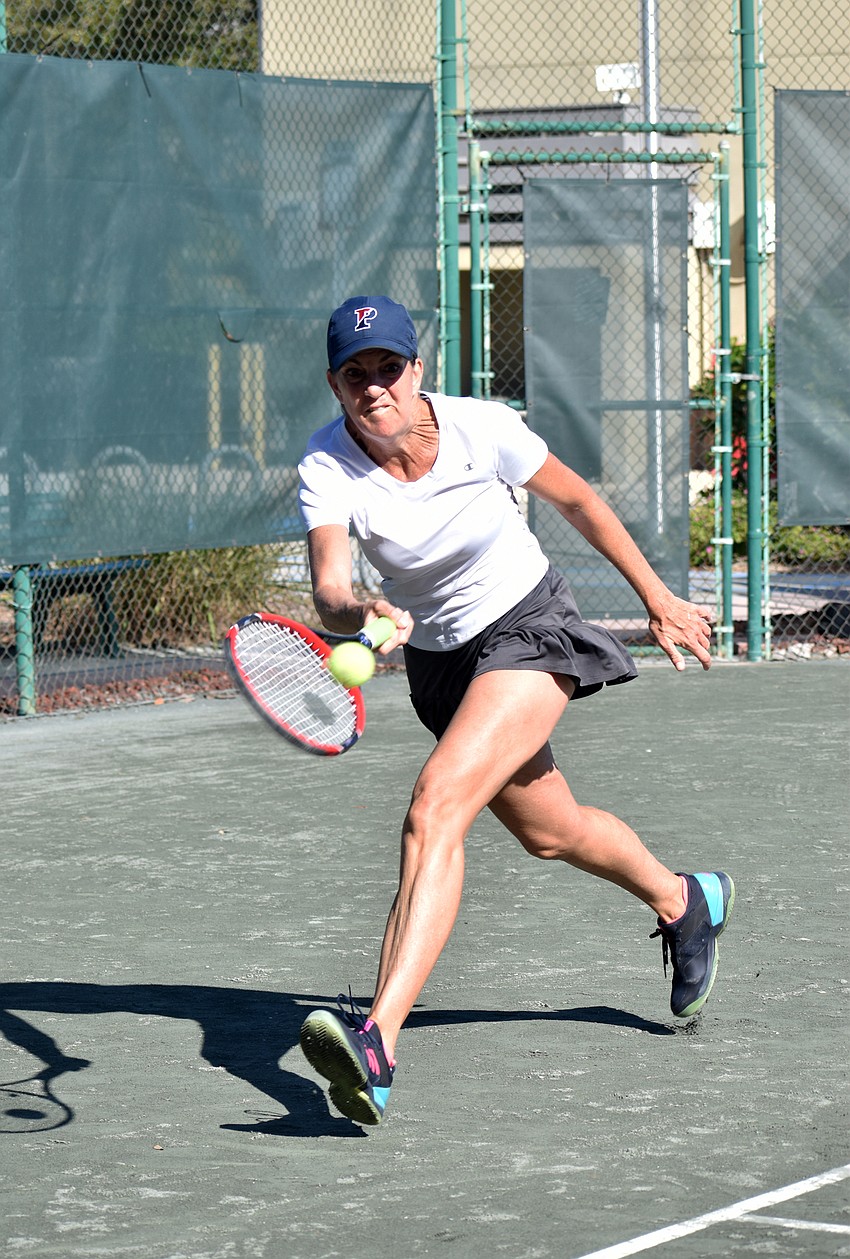 Janine Fusco competes against Angie Eason in a singles match on Friday, Jan. 11.