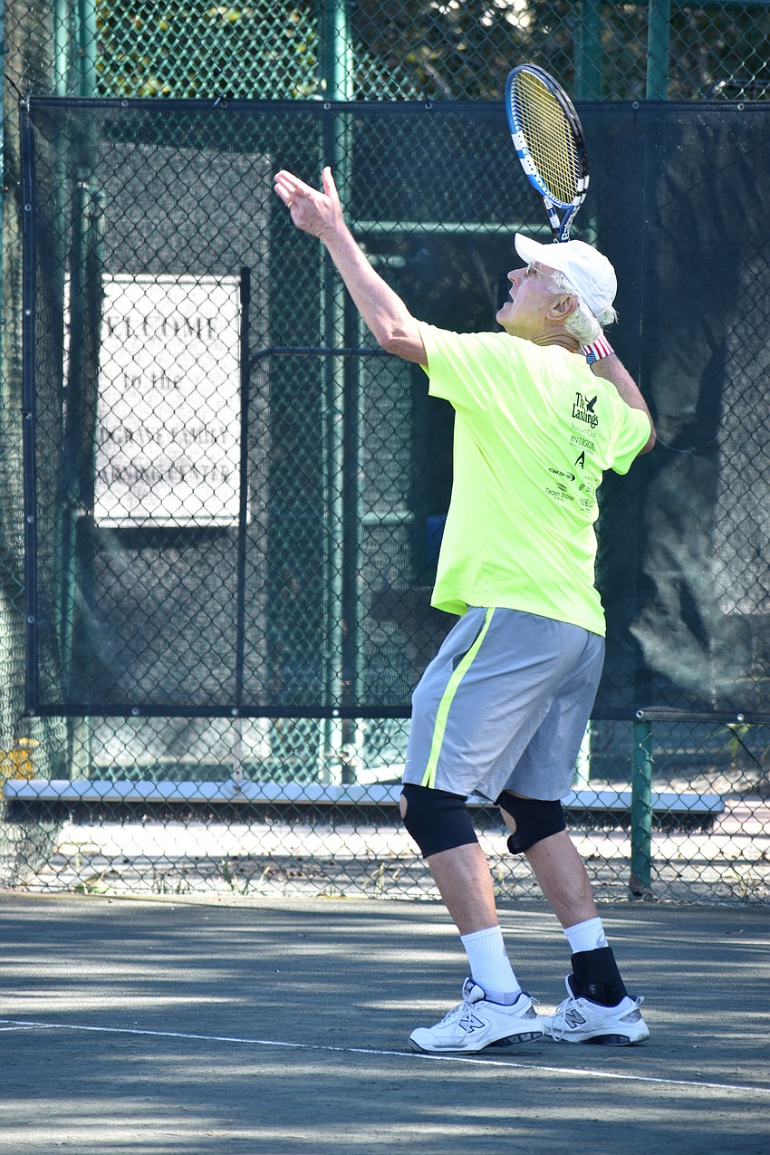 Charlie Muntan serves the ball during a doubles match on Friday, Jan. 11.