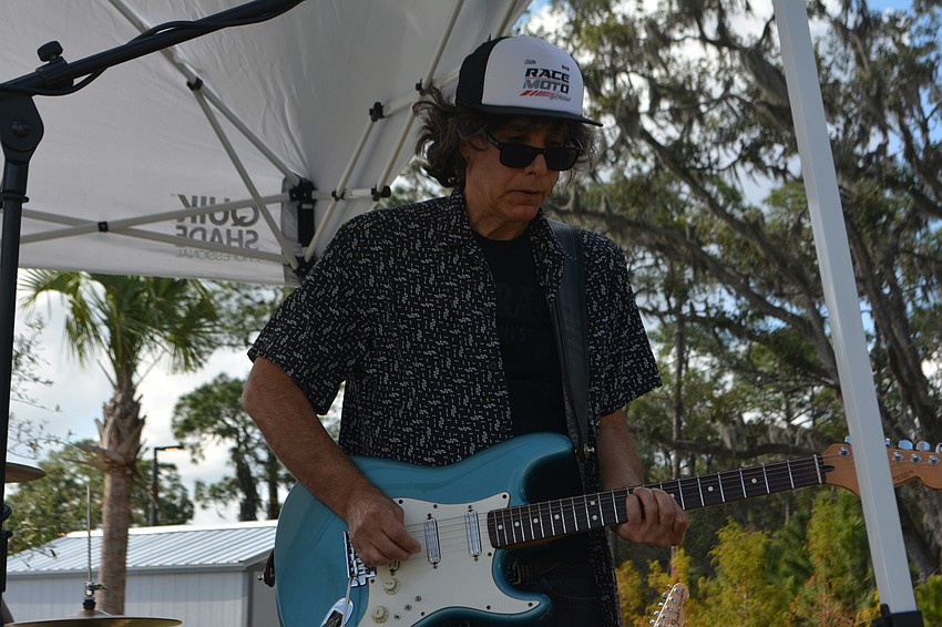 Stuart Newman, a guitarist for the IPA Band, rocks the event.