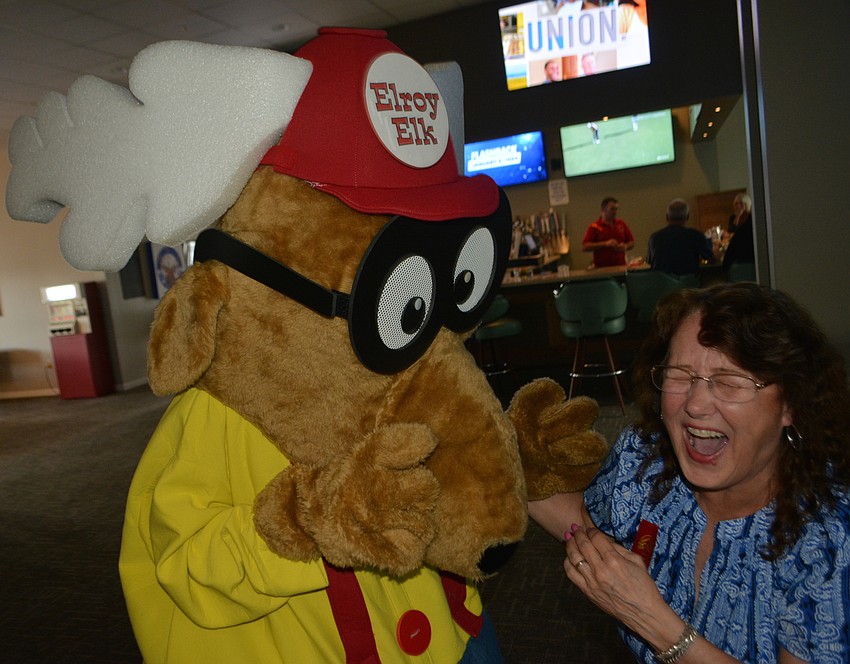 Elroy the Elk entertains Elks member Susan Jelke.