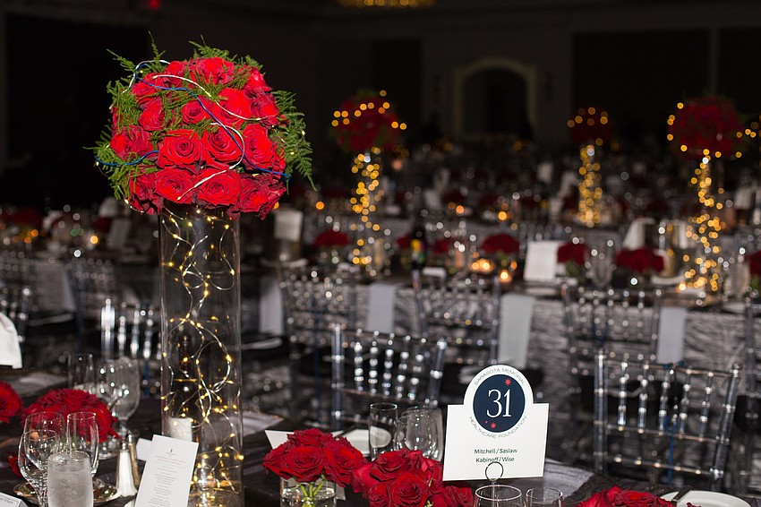 The ballroom was decorated with red roses.
