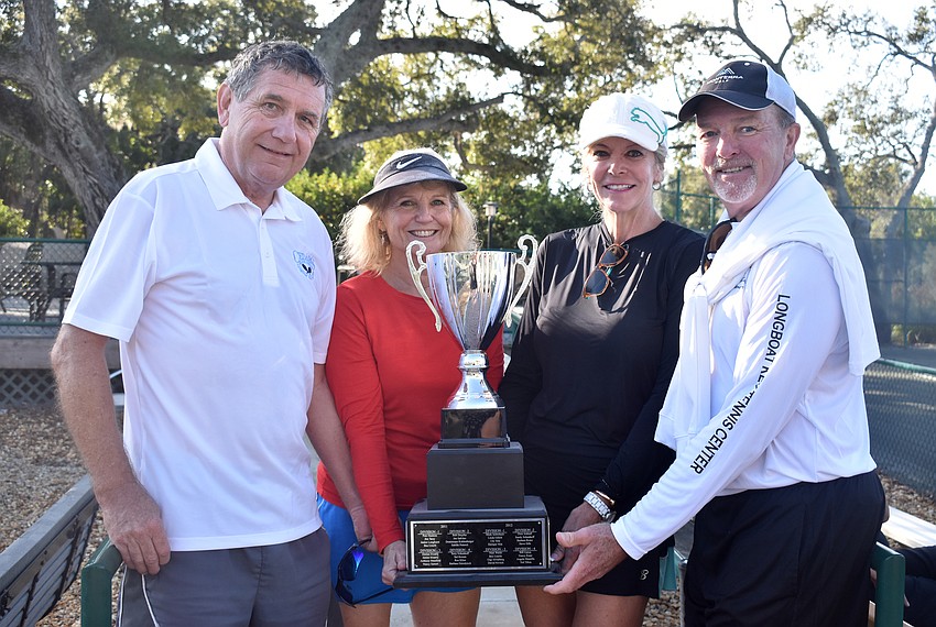 Division 4 champions Ray and Jacqui Ellis, Suzy White and Kevin Feeney