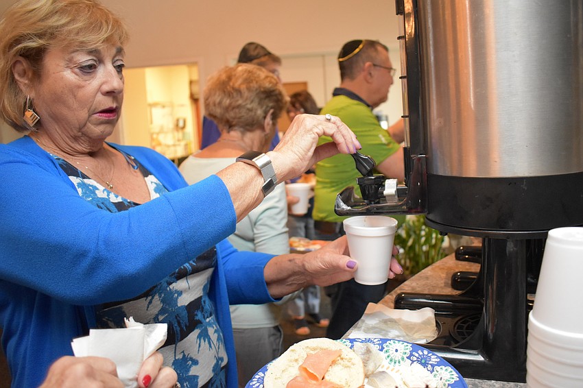 Ingrid Bookbinder grabbed some coffee for the early morning event.
