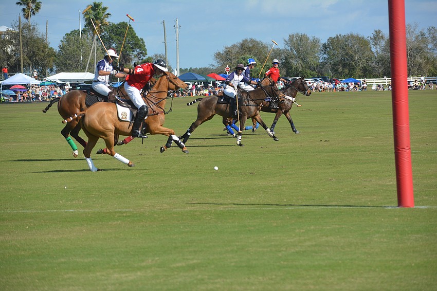 Wrigley Media's James Miller clears the ball from in front of the goal.