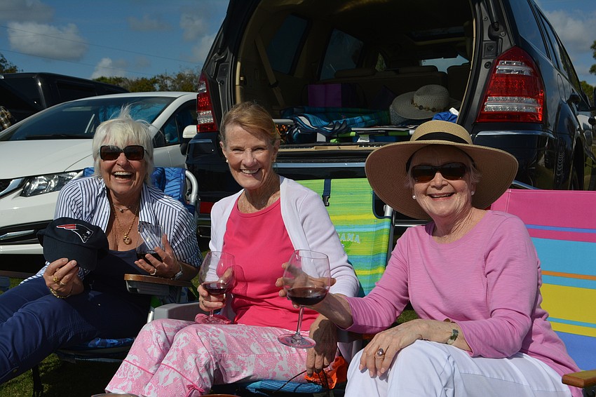 Longboat Key's Claudia Hennigan and Sarasota's Sheila Donnell and Jane Carpenter enjoy some wine tasting while they bask in the perfect weather.