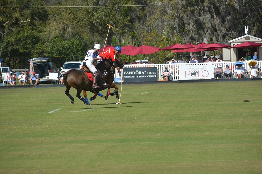 Wrigley Media's Raj Singh and Kelly Beck of The Internationals face off during first-half action.