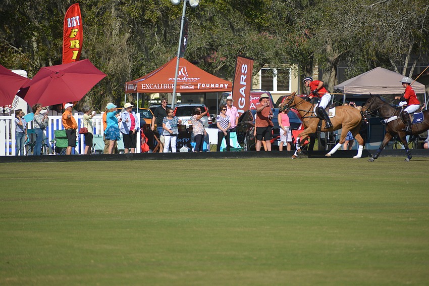 Sarasota Polo Club owner James Miller gives some love to the crowd before the match.