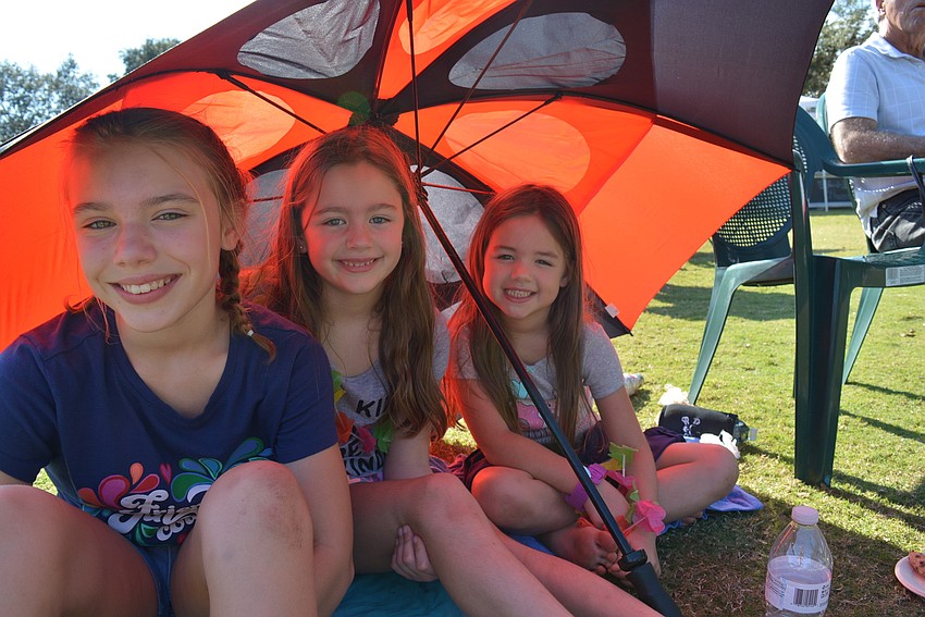 Winter Park's Veda Stork and her cousins, Scarlett and Kinley Gratton of Sarasota, came to watch Veda's dad, Ed Stork, play in the band.