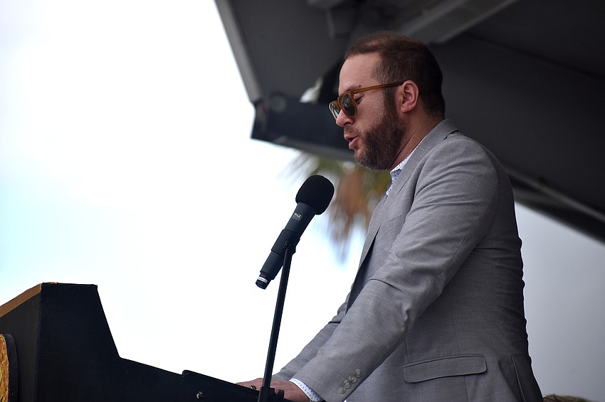 Isaac Morris speaks on behalf of his late father, Ron Morris, who was on of the inductees.