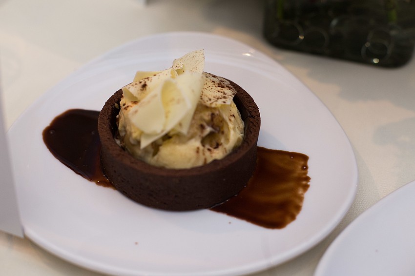 A white chocolate-banana cream tart was placed on each guest's place setting.