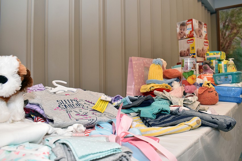 Every attendee brought a toy, clothing or diapers to be donated.