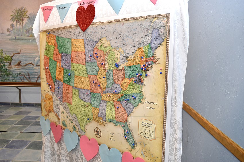 Attendees pinned pushpins on a map to show where their grandchildren live.