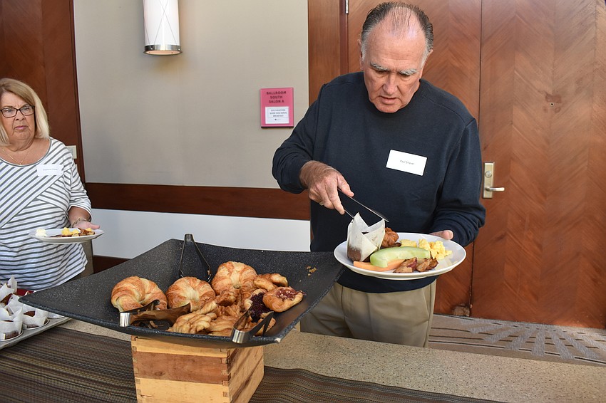 Paul Shaver grabs some breakfast in the buffet line.