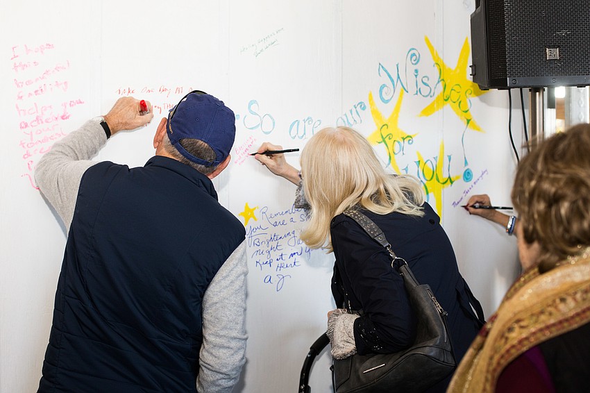 Guests signed the wall with messages to comfort the children who come into the building.